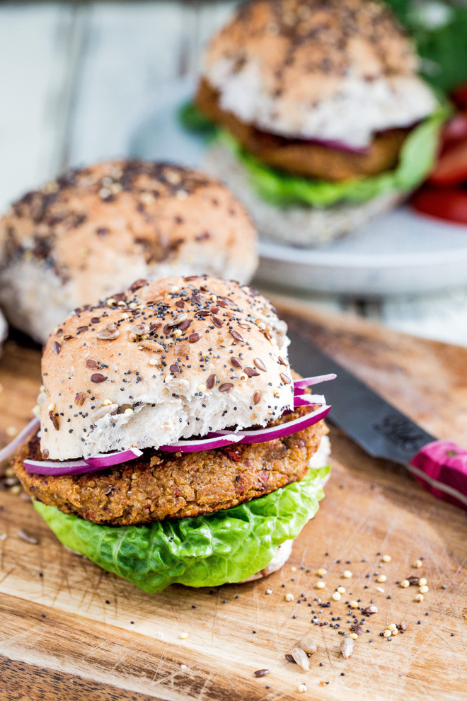 Tasty, healthy and gluten-free easy vegan bean burger recipe made with quinoa, cannellini beans and sun dried tomatoes. These burgers really pack in the flavour!