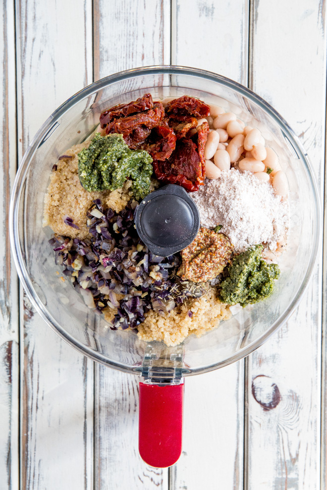 Tasty, healthy and gluten-free easy vegan bean burger recipe made with quinoa, cannellini beans and sun dried tomatoes. These burgers really pack in the flavour!