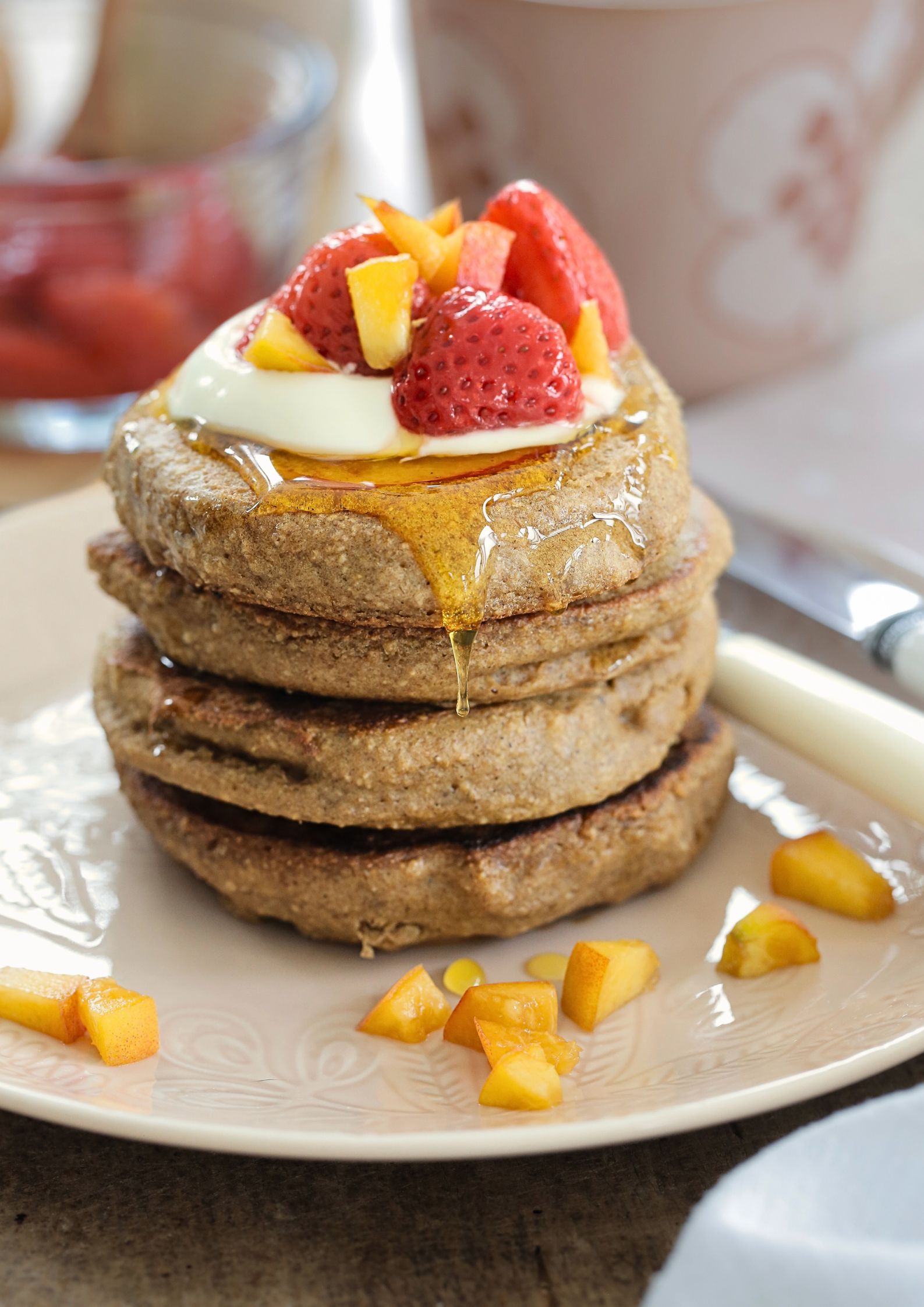 Gluten free vegan peach pancakes - light, fluffy, fruity and the perfect easy summer breakfast