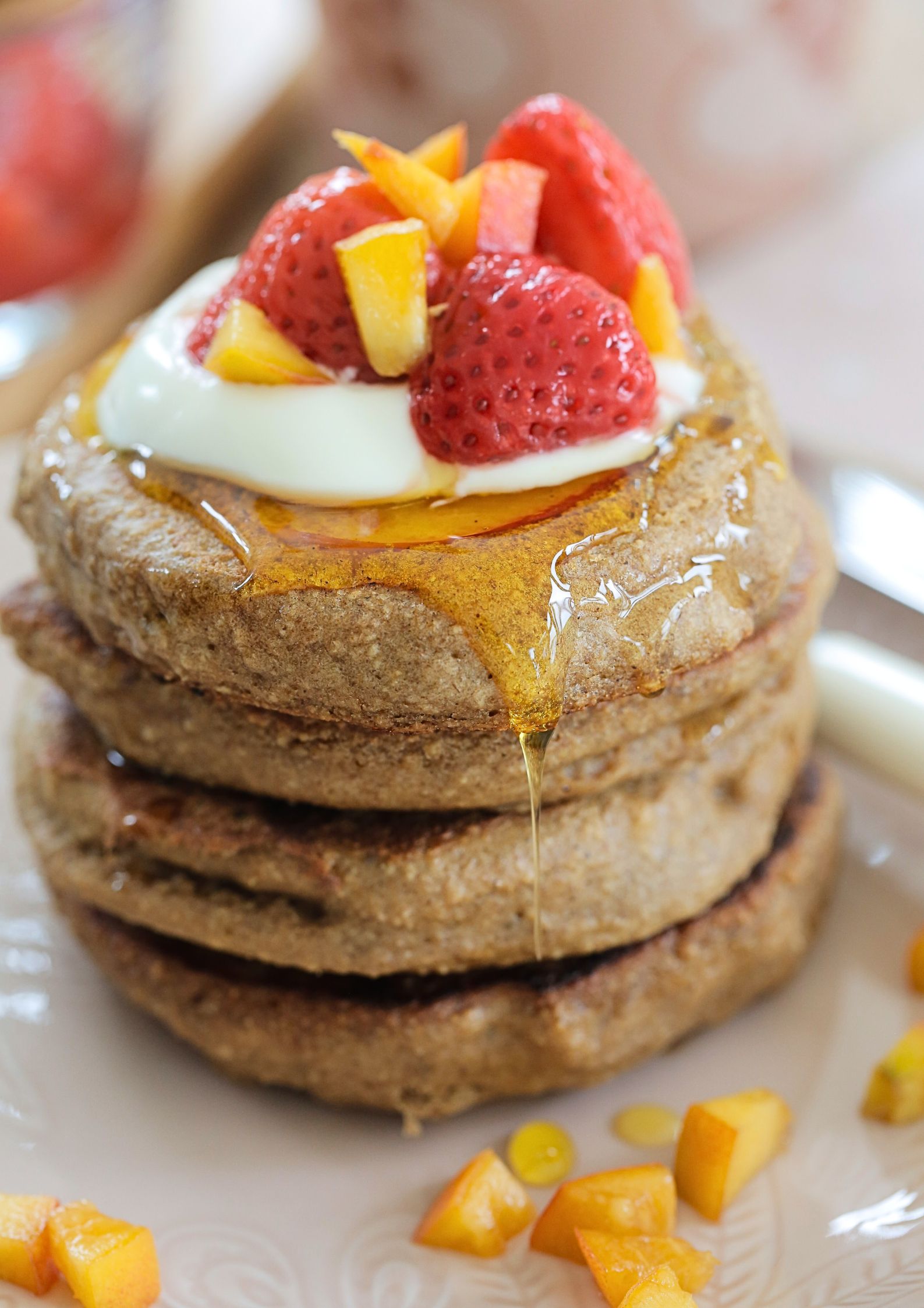 Gluten free vegan peach pancakes - light, fluffy, fruity and the perfect easy summer breakfast